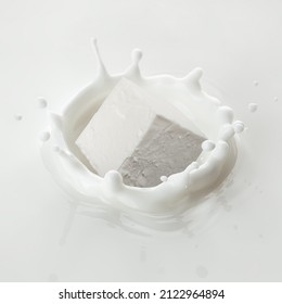 Feta, Greek Cheese Cube Falls Into Milk, Yoghurt, Sour Cream, Splash