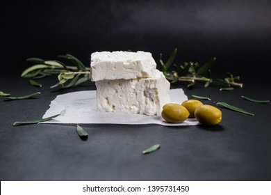 Feta Greek Cheese With Olives On Black Background