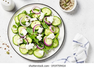 Feta red onion cucumber salad. Space for text, top view.