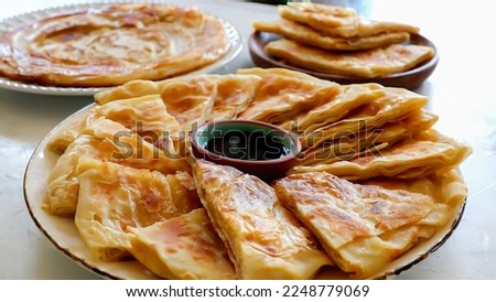 Feteer meshaltet - Feteer (Egyptian Pie), It consists of many thin layers of dough and ghee and an optional filling. The fillings can be both sweet or savory. Stock photo © 