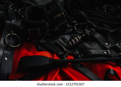 Fetish Whip And Hand Cuffs For Fetish/bdsm Games On Dark Background