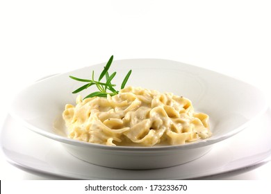 Fettuccine Alfredo With Homemade Sauce On A White Background.