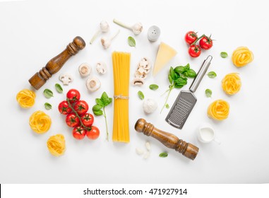 Fettuccine and spaghetti with ingredients for cooking Italian pasta on a white background, top view. Flat lay - Shutterstock ID 471927914
