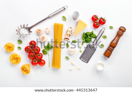 Fettuccine and spaghetti with ingredients for cooking pasta on a white background, top view. Flat lay