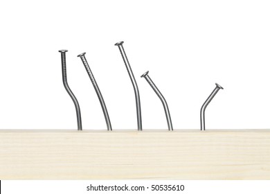 Few bent nails driven-in wooden board. Isolated on white with clipping path
