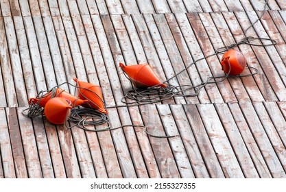 A Few Buoys On A Wooden Pontoon