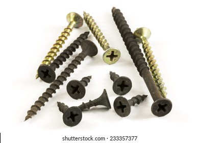 A few drywall Phillips screws with a bugle head isolated over white background