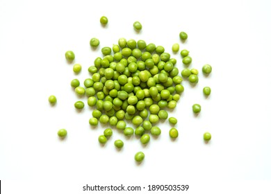 Few green peas isolated on white in the center.