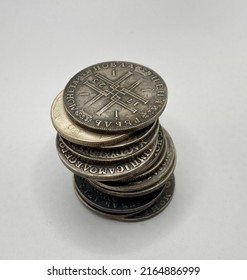 A Few Old Silver Coins In A Pile