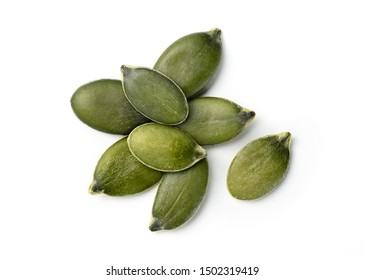 few pumpkin seeds isolated on white