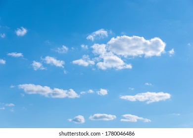 few random white clouds in blue sky, partly cloudiness - Powered by Shutterstock