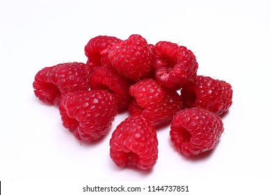 A few raspberries on a white background