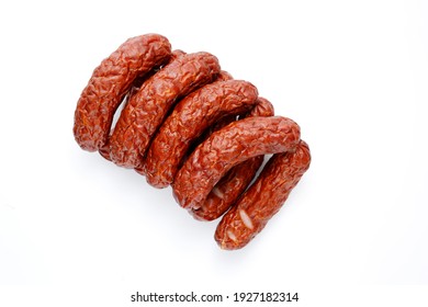 Few Rings Of Country Style Dry, Smoked Sausage, Isolated On A White Background, Top View. Traditional, Bio, Organic Eastern Europe, Polish Meat Sausage With Natural Garlic Aroma, A Packshot Photo.