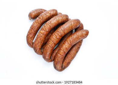 Few Rings Of Country Style Smoked Sausage, Isolated On A White Background, Top View. Traditional, Bio, Organic Eastern Europe, Polish Meat Sausage With Natural Garlic Aroma, A Packshot Photo.