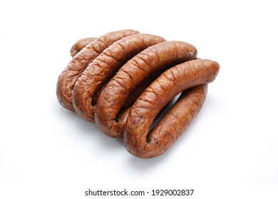 Few Rings Of Country Style Smoked Sausage, Isolated On A White Background. Traditional, Bio, Organic Eastern Europe, Polish Meat Sausage With Natural Garlic Aroma, A Packshot Photo.