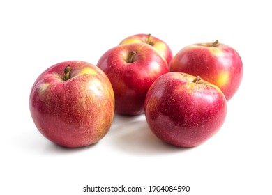 Few ripe red-yellow seasonal apples on a light background