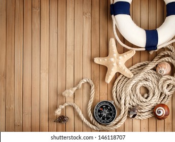 Few Summer Marine Items On A Wooden Background.