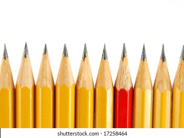 A few yellow pencils and the one red