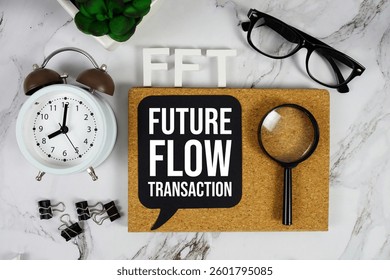 FFT - Future Flow Transaction acronym with alarm clock and magnifying glass, business concept background