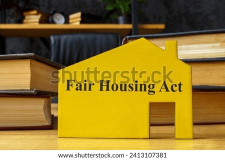 FHA fair housing act concept. Wooden model of house with an inscription.