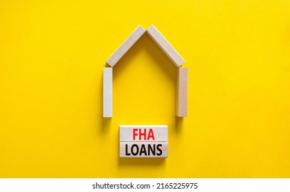 FHA Federal Housing Administration Loans Symbol. Concept Words 'FHA Federal Housing Administration Loans' On Wooden Blocks On A Beautiful Yellow Background. Business And FHA Loans Concept. Copy Space.