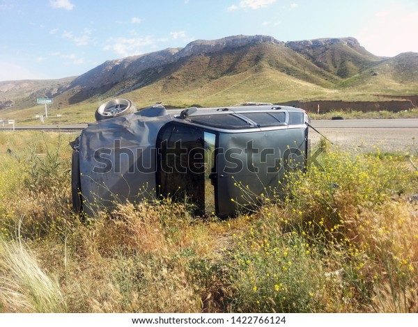 Fiat\
Tipo branded car crashed near the highway and tumbled. Crashed Fiat\
Tipo on a towing truck. Ankara. Turkey. June\
2015.