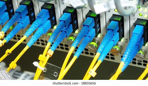 Fiber Cables Connected To Servers In A Datacenter