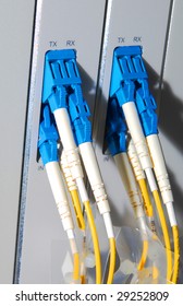 Fiber Cables Connected To Servers In A Datacenter