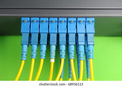 Fiber Cables Connected To Servers In A Datacenter