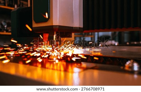 The fiber laser cutting machine controller by CNC program.The sheet metal cutting process by CNC fiber laser cutting. CNC Laser cutting of metal, modern industrial technology.