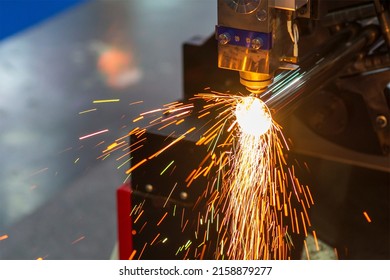 The fiber laser cutting machine cutting  machine cut the metal tube. The hi-technology sheet metal manufacturing process by laser cutting machine. 
