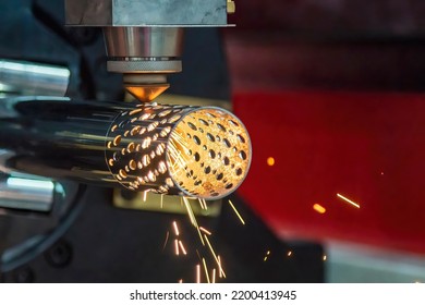 The fiber laser cutting machine cutting  machine cut the stainless steel tube. The hi-technology sheet metal manufacturing process by laser cutting machine.  - Shutterstock ID 2200413945