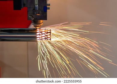 The fiber laser cutting machine cutting  machine cut the stainless steel tube. The hi-technology sheet metal manufacturing process by laser cutting machine.  - Shutterstock ID 2225555955
