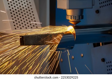 The fiber laser cutting machine cutting  machine cut the stainless steel square tube. Fiber laser cutting machines use a highly focused laser beam to cut through a stainless steel tube materials with  - Shutterstock ID 2253029225