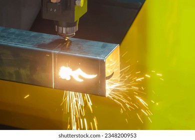 The fiber laser cutting machine cut the square stainless steel tube. The hi-technology sheet metal manufacturing process by laser cutting machine.  - Powered by Shutterstock