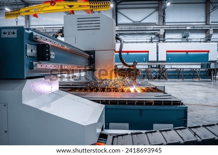The fiber laser cutting machine cutting machine cut the metal plate. The hi-technology sheet metal manufacturing process by laser cutting machine.