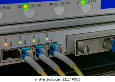 Fiber Optic Cable Are Connected To The Interfaces Of The Central Router. Modern Equipment Of The Data Processing Center. Backbone High-speed Internet Communication Channel.