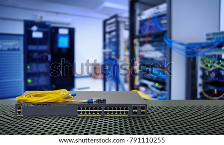 Fiber optic cable and Network switch 24 port gigabit and 4 port module with Power over Ethernet (PoE) function on port for high speed network in data center room