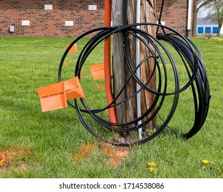 Fiber Optic Cable, Orange Marking Flags And Utility Pole. Concept Of Digging Safety, Utility Locate Service And High Speed Internet.