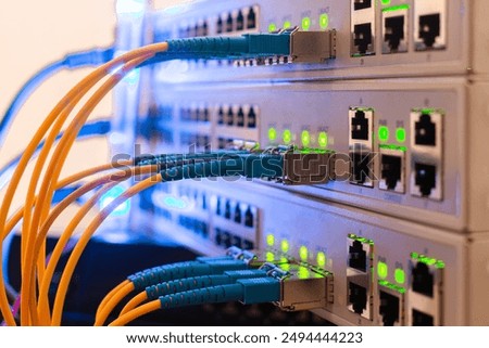 Fiber optic cables are connected to the switch interfaces. High speed concept