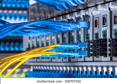 Fiber optic connecting on core network swtich - Shutterstock ID 358707350