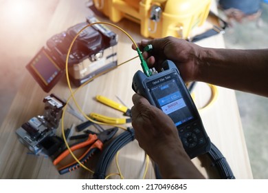 Fiber Optic Fusion Splicing Cable Internet signal and Wire connection with Fiber Optic Fusion Splicing machine,fiber optic cable splice machine in work - Shutterstock ID 2170496845