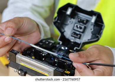 Fiber Optic Fusion Splicing Internet equipment flat lay and Wire connection with Fiber Optic Fusion Splicing machine,fiber optic cable splice machine in work - Shutterstock ID 2167760957