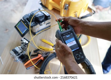 Fiber Optic Fusion Splicing Internet equipment flat lay and Wire connection with Fiber Optic Fusion Splicing machine,fiber optic cable splice machine in work - Shutterstock ID 2168370621