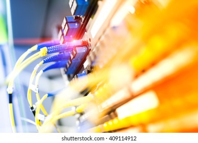 fiber optic with servers in a technology data center .