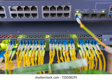 fiber optic with servers in a technology data center . - Shutterstock ID 725038195