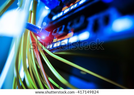 fiber optic with servers in a technology data center .
