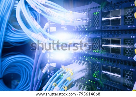 Fiber Optical connector interface. Rack Mounted Servers In A Server Room, Server rack audio cable. Severs computer in a rack at the large data center. has a small noise.