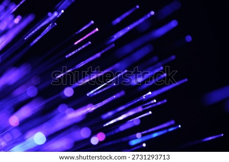 Fiber optical network cable in blue light. close up macro