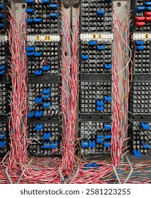 Fiber optical network cables panel. Old telephone cross connection box.